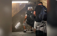 In the New York subway, water reaches people to their waist