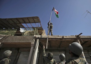 Промежуточная победа НАТО: На крыше центрального рынка Марджи водрузили афганский флаг