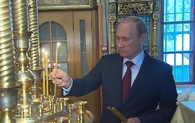 Путин поставил свечи за  защитников Новороссии 