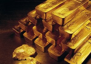 Мировые цены на золото незначительно снизились