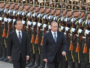 Путина в Китае встретили залпами орудий