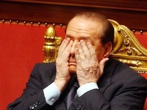 Берлускони пообещал уйти в отставку, если подтвердятся слухи о его романе с моделью