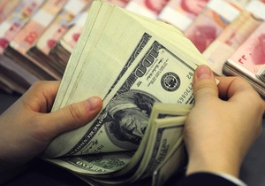Аналітика: чи винна політика США в ралі юаня