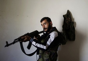 Фотогалерея: Озброєні до зубів. Фотосесія сирійських повстанців для міжнародних репортерів