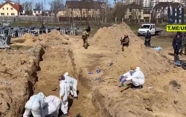 Застрелених жителів Бучі в братських могилах ховав комунальник