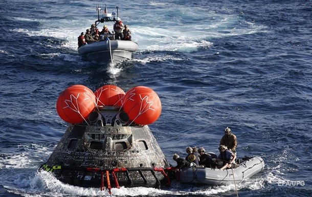 The Orion spacecraft splashed into the Pacific Ocean after flying over the moon