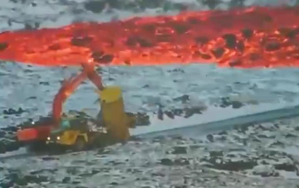 Извержение вулкана в Исландии: лаву пытаются остановить экскаваторами