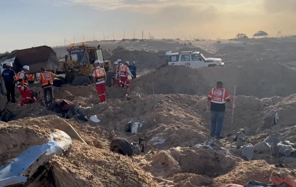 В Газе в  братской могиле  найдены тела 14 пропавших гумработников