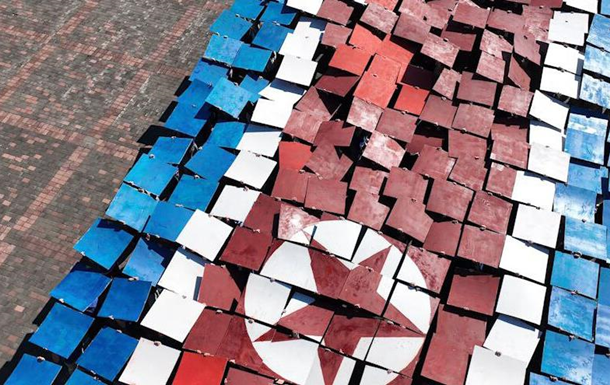 В Донецке провели акцию ко Дню независимости КНДР